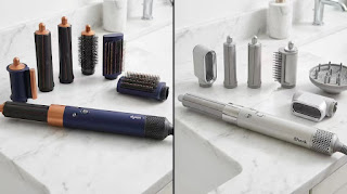 Dyson Airwrap vs Shark FlexStyle comparison on a marble counter showing different attachments and build quality.