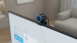 The Govee single camera sensor mounted on top of a slim LED TV.