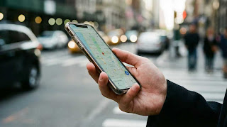 Holding iPhone 17 Pro Max one-handed, showing the ergonomic challenge for smaller hands.