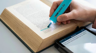 Scanmarker Air digital highlighter pen scanning text from a textbook directly to a tablet screen.