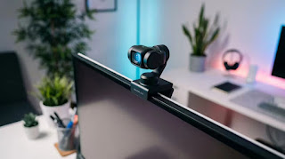 Insta360 Link 4K AI webcam mounted on a monitor with gimbal tracking for remote work setups.