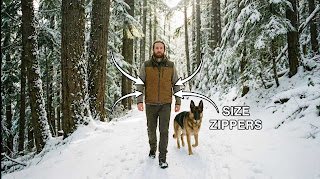 ARRIS adjustable heated vest being worn by a hiker in the snow.]
