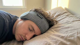 MUSICOZY Sleep Headphones Bluetooth Headband worn by a side sleeper, demonstrating comfort and thin speakers.