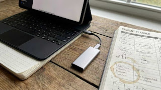 External USB-C SSD drive connected to iPad for extra college storage space.