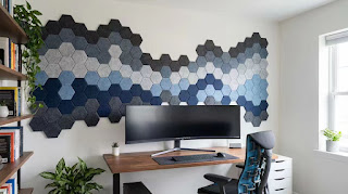 BUBOS hexagonal acoustic panels mounted on a home office wall for sound dampening.