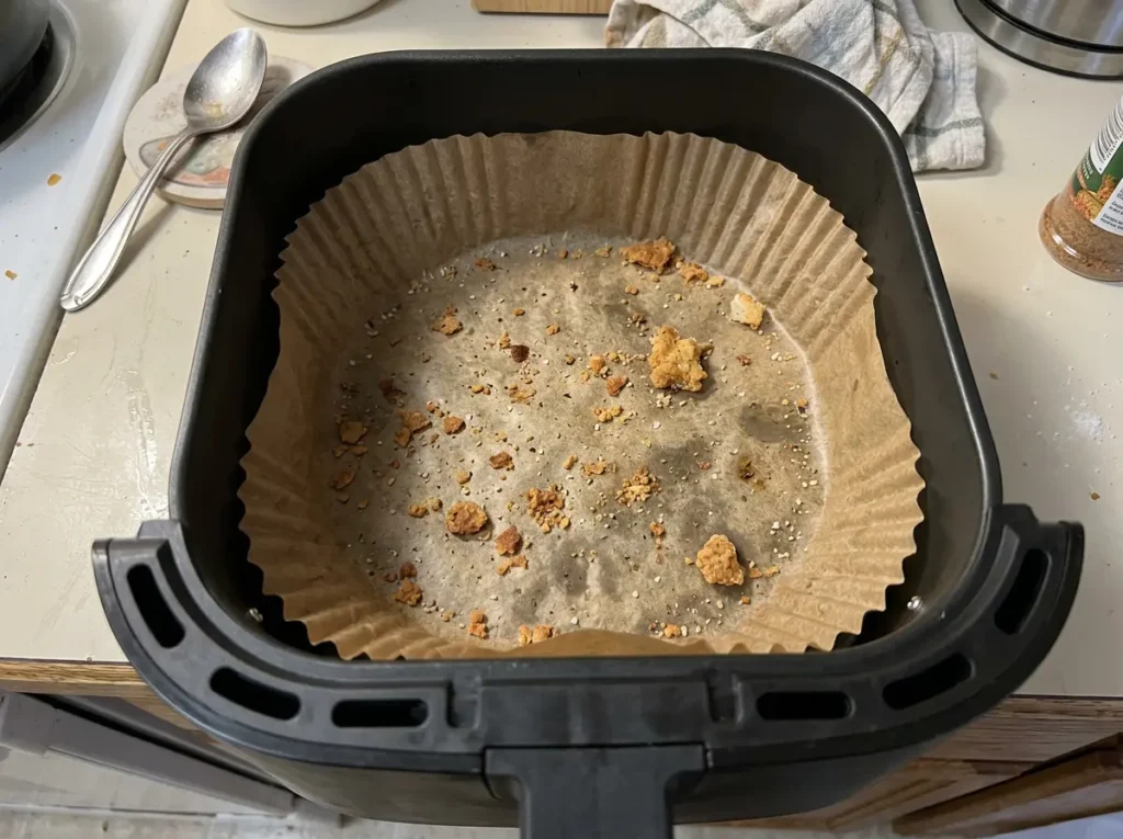 Disposable air fryer parchment paper liners for zero midnight cleanup.