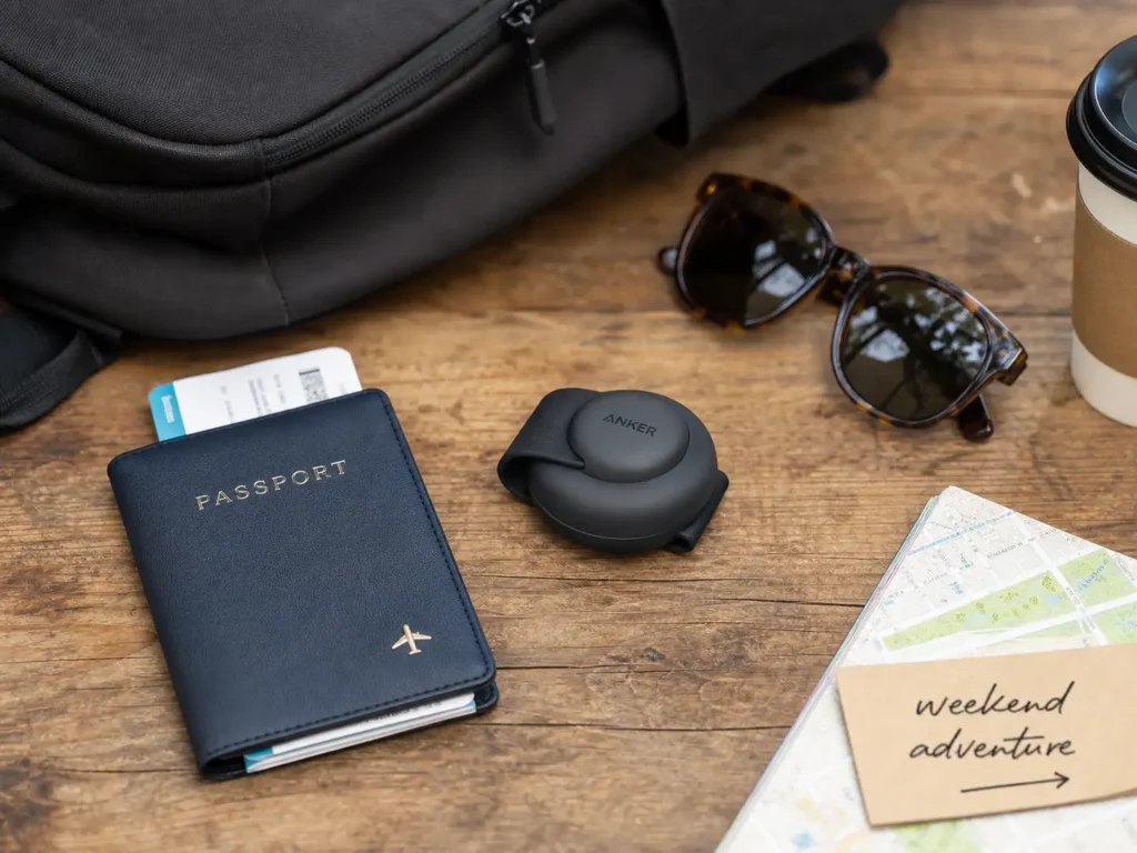 Anker MagGo Foldable 3-in-1 Wireless Charging Station shown in its closed travel state next to accessories.