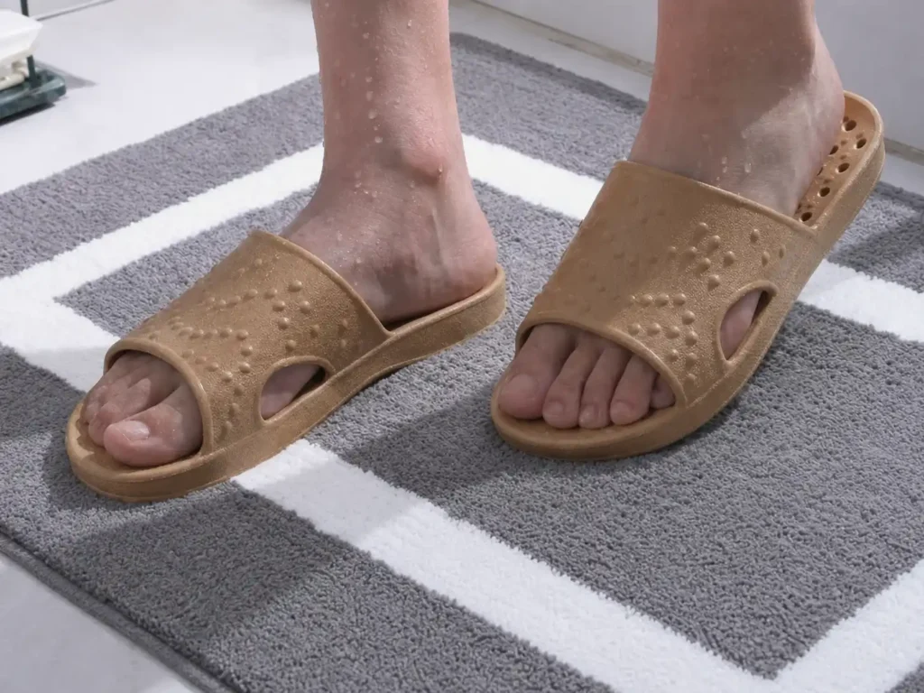 SheValues quick-drying shower shoes with drainage holes on wet bathroom tiles