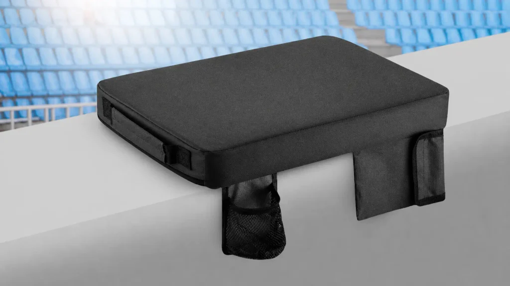 Alpcour waterproof heated bleacher cushion resting on outdoor sports stadium seating