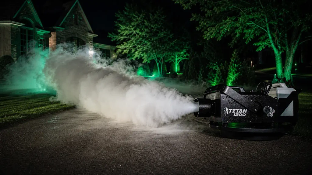 Froggy's Fog Titan 1200 generating high-volume mist across a large outdoor lawn