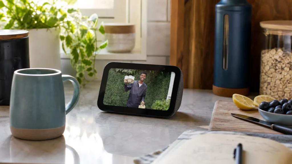 Amazon Echo Show 5 on a kitchen counter controlling compatible smart home devices